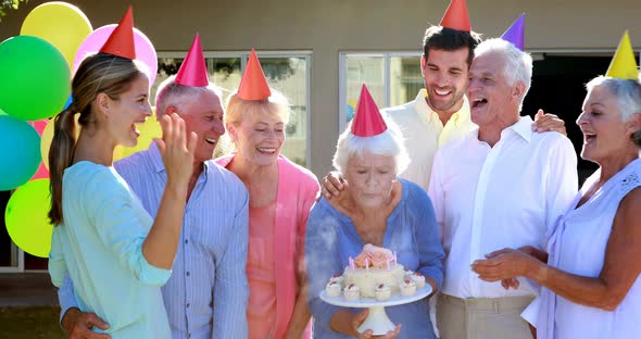 Doctors and senior citizen celebrating birthday