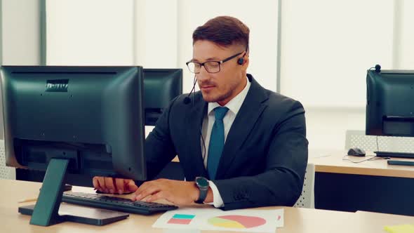 Business People Wearing Headset Working in Office