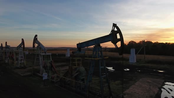 Flying Near Working Oil Pumps at Sunset