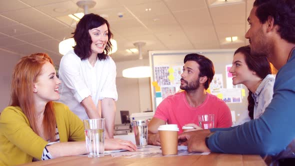 Business colleagues shaking hands in the meeting