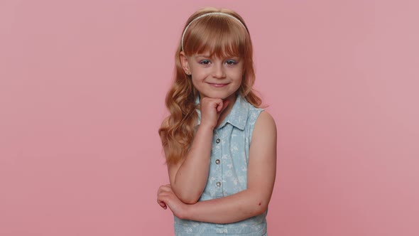 Cheerful Lovely Young Preteen Child Girl Kid Smiling Looking at Camera on Studio Pink Background