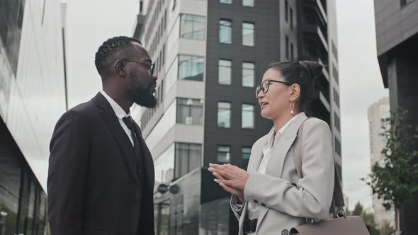 Business Colleagues Having Conversation Outside