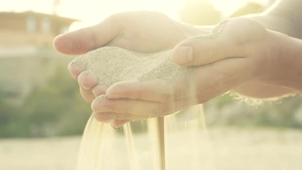 Sand Strewed Through Fingers Hands