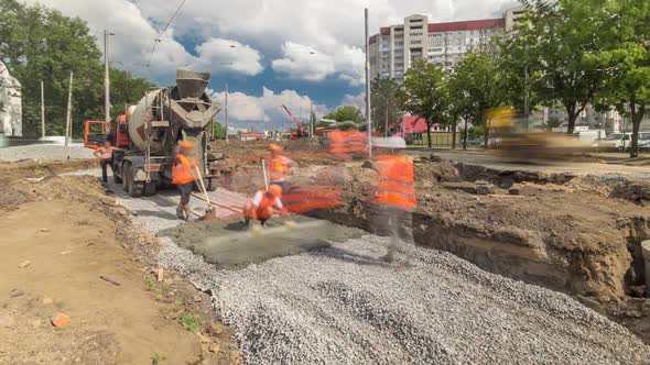 Concrete Works for Road Maintenance Construction with Many Workers and Mixer Timelapse