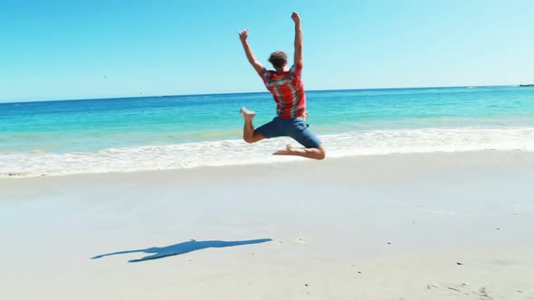 Man dancing on the beach