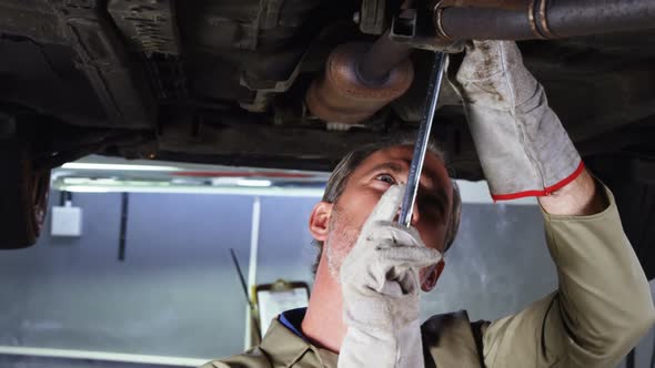 Mechanic servicing a car