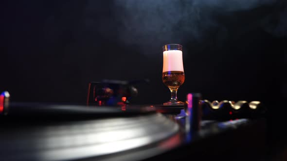 DJ in 1970s and 1980s Gramophone Vinyl Record Cigarette Smoke Beer Glass