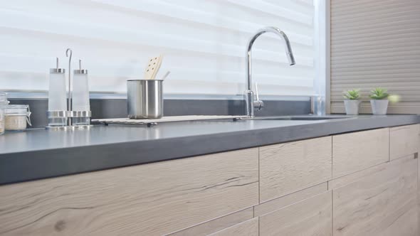 Tracking shot of a luxury kitchen with wood finish modern design