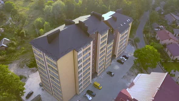 Aerial View of Multistory Apartment Building in Green Residential Area