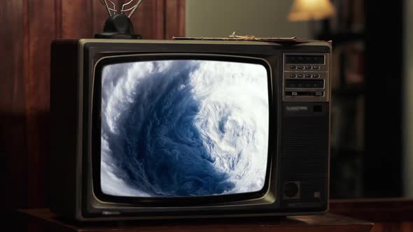 Eye of Hurricane seen from Space on a Retro Television.