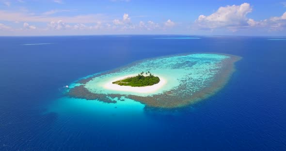 Aerial drone view of a scenic tropical island in the Maldives