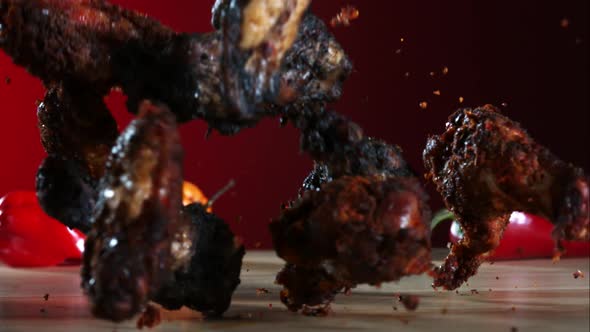 Smoked chicken wings falling and bouncing in ultra slow motion 1500fps - CHICKEN WINGS PHANTOM 036