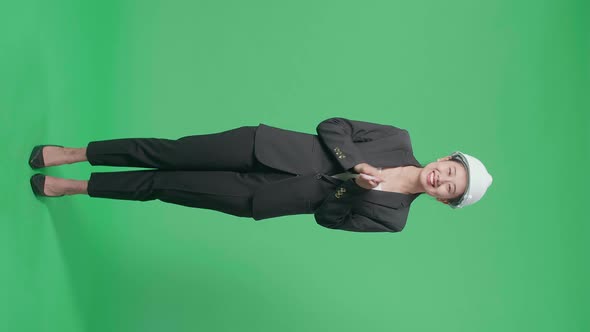 Full Body Of Female Engineer With Safety Helmet Clapping Her Hands In The Green Screen Studio