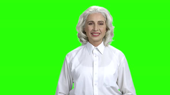 Pretty Senior Woman Giving Thumb Up on Green Screen