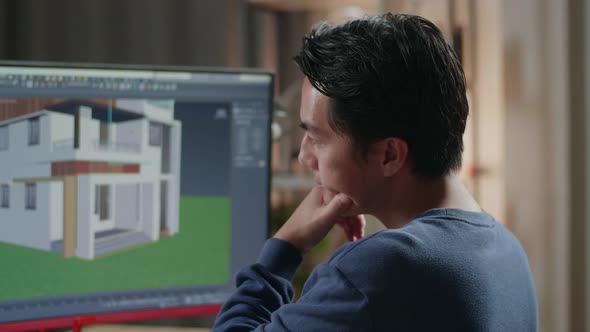 Close Up Of Asian Male Engineer Thinking While Designing House On A Desktop At Home