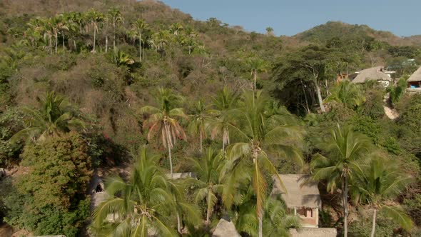 Secluded Tropical Resort With Huts In Yelapa Beach Town, Jalisco, Mexico. Aerial Approach Shot