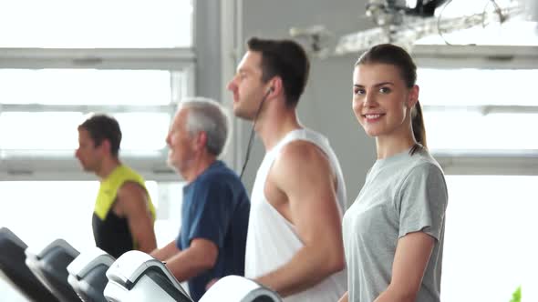 Group of People Exercising at Gym.