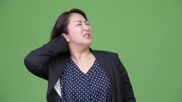 Mature Beautiful Asian Businesswoman Having Neck Pain