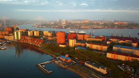 Drone View of the City and Marina Located on the Peninsula at Sunset