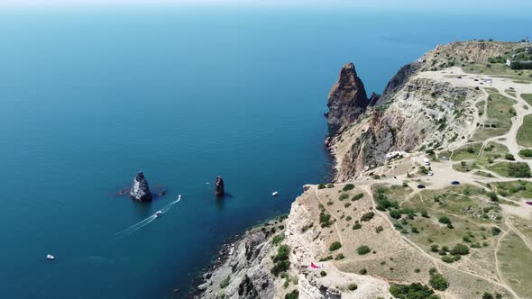 Aerial View From Above on Calm Azure Sea and Volcanic Rocky Shores