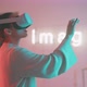 Young woman experiencing virtual reality and smiling in neon lights and sign in the background - VideoHive Item for Sale