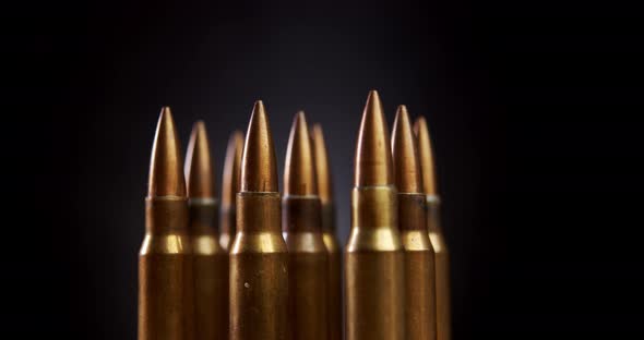 Gold Rifle Ammunition on Black Background