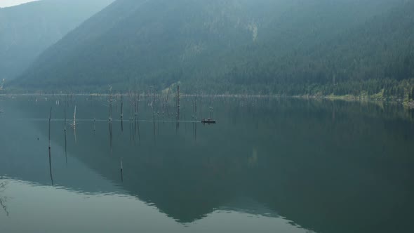 Aerial, Earthquake Lake in Montana on a gloomy evening day