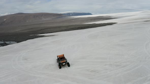 Extreme Adventure 4-wheel Driving And Snowmobiling On Langjokull Ice Cap In Iceland. aerial drone