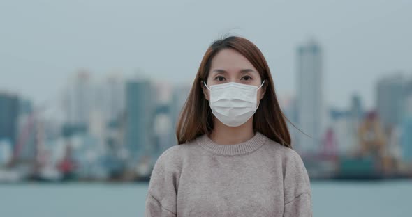 Woman wearing face mask in city