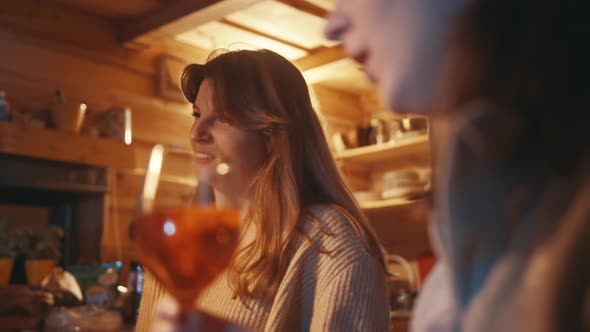 Young Women Best Friends Having a Drink in the Bar During the Winter Vacation