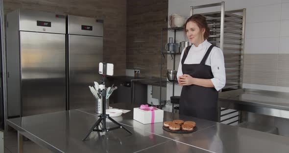 A Professional Chef Conducts a Master Class and Flips Through the Touch Screen