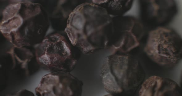 Macro of Peppercorns on a white plate