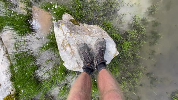 Hiker balancing on rock at Rautispitz Switzerland gopro shot