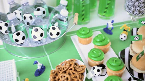 Kids football party set with snacks and drinks.