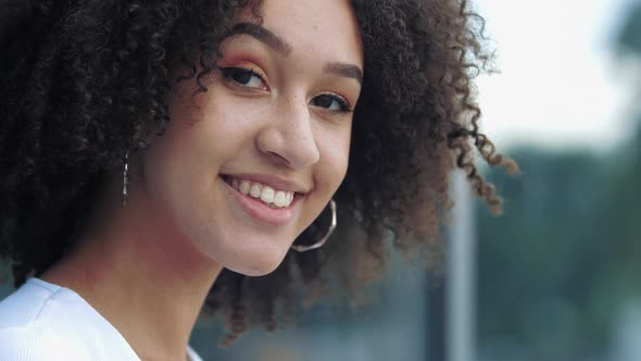 Close-up of Pretty Young Afro American Millennial Woman Smile with Happiness Joy at Camera Playfully