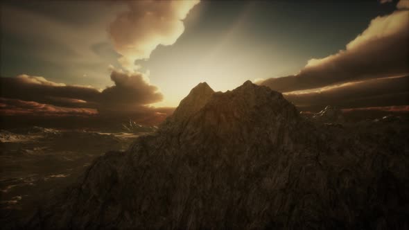 Sun Rays Over Mountains in a Valley