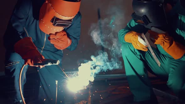 Metal Welder Working with Arc Welding Machine