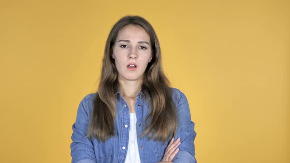 Sad Upset Pretty Woman Isolated on Yellow Background