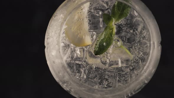 Bubbled Lemon Ice Mint Cocktail Spinning Glass Closeup