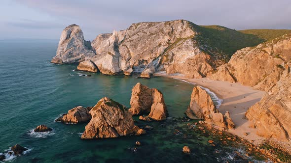 Aerial Drone View of Praia Da Ursa Beach in Sintra Portugal in Sunset Golden Hour Light