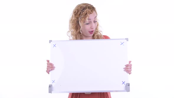 Happy Beautiful Blonde Businesswoman Holding White Board