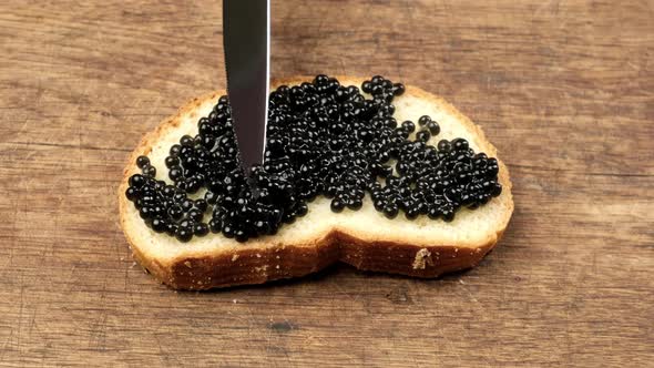 delicious black paddlefish caviar and a slice of bread made from white wheat flour