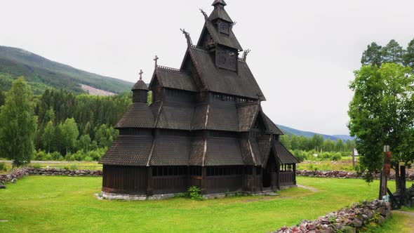 Establishing shot of the Heddal Stave Church in Norway. Wide shot, pull back.