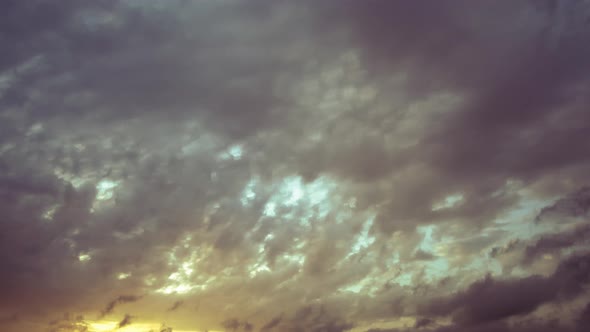 Dynamic and dramatic cloudscape time lapse with layers of clouds giving a three-dimensional look - s