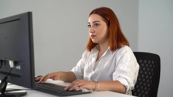 Woman Working on Computer in Office 4K