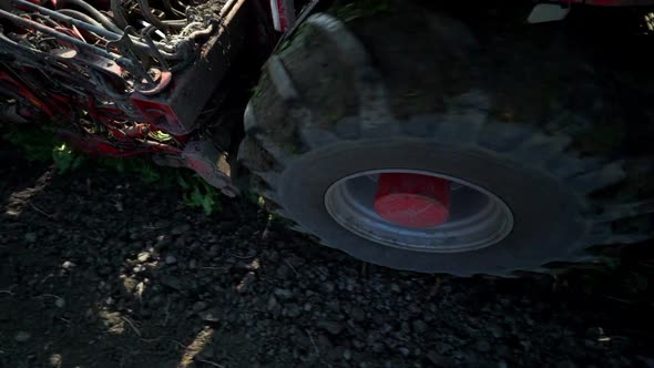 Detail Wheel of Harvester Working on Field