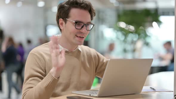 Man Talking on Video Call on Laptop