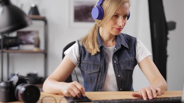 Female Editing Photos at Office