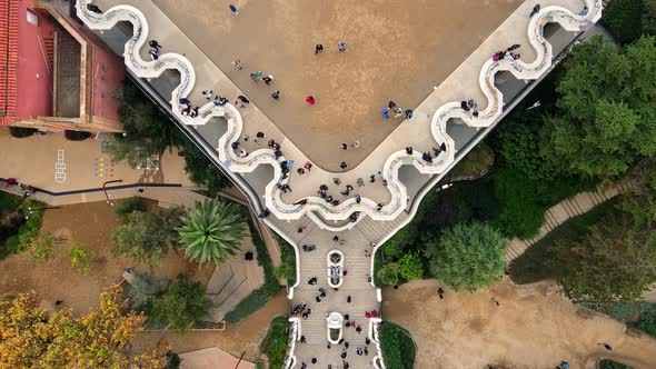 Aerial drone view of Barcelona, Spain. Park Guell with tourists, a lot of greenery