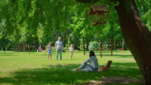 Cheerful Family Leisure in Summer Park